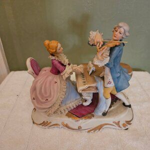 Vintage Porcelain (Artmark) Figurine lady playing piano and man with violin.